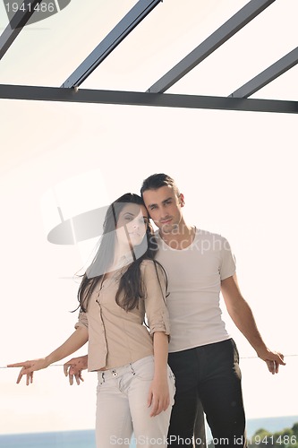 Image of couple relaxing on balcony