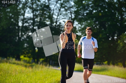 Image of Young couple jogging