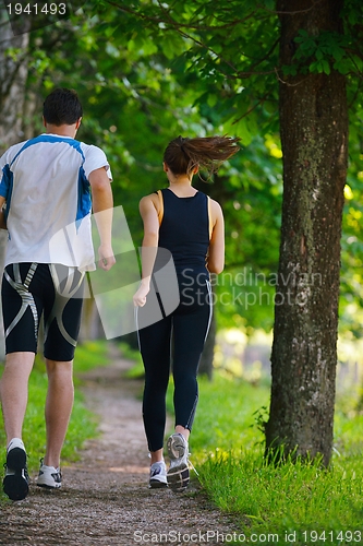 Image of Young couple jogging