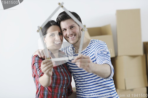 Image of Young couple moving in new home