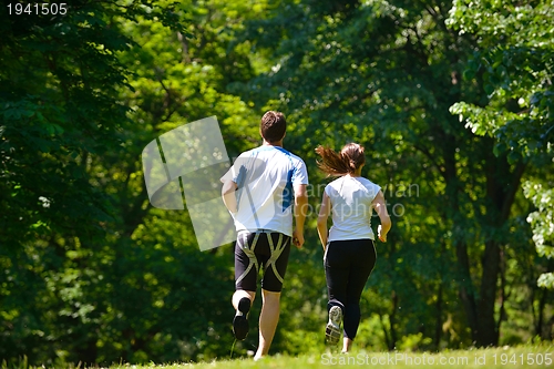 Image of Young couple jogging