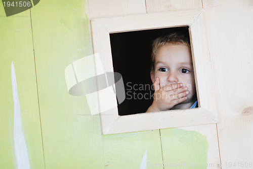 Image of happy child in a window
