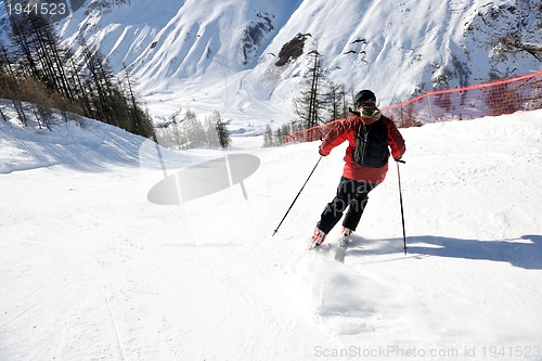 Image of skiing on fresh snow at winter season at beautiful sunny day