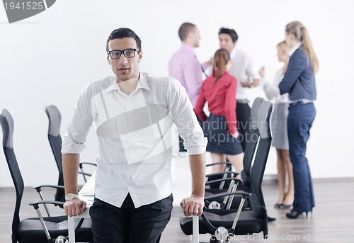 Image of young business man at meeting