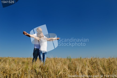 Image of happy couple in wheat field
