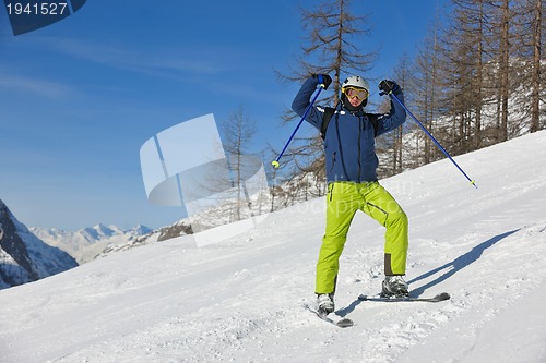 Image of skiing on fresh snow at winter season at beautiful sunny day