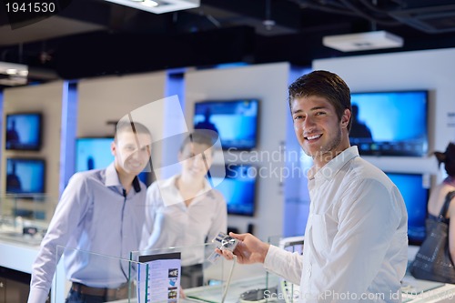 Image of people buy  in consumer electronics store