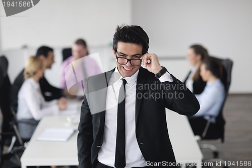 Image of young business man at meeting