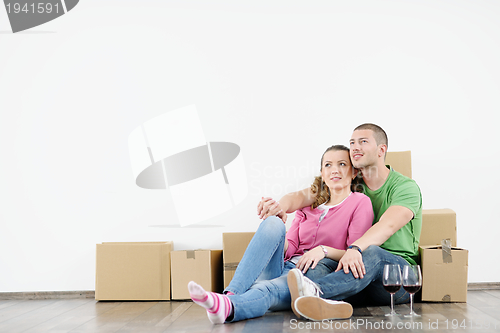 Image of Young couple moving in new house