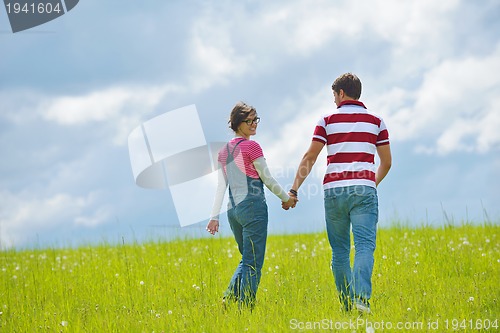 Image of romantic young couple in love together outdoor