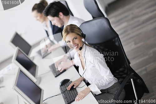 Image of business people group working in customer and help desk office