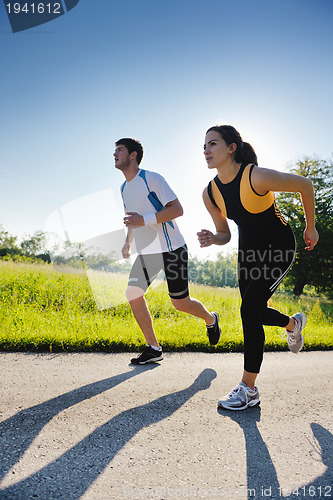 Image of Young couple jogging