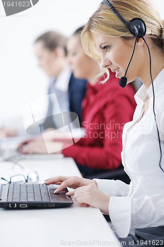 Image of business woman group with headphones