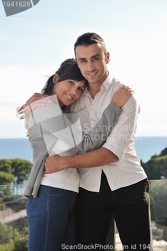 Image of couple relaxing on balcony