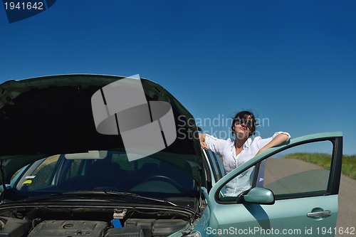 Image of woman with broken car