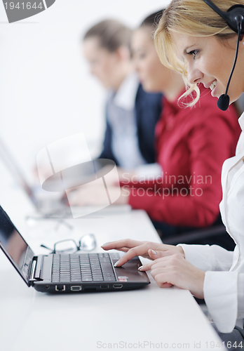 Image of business woman group with headphones