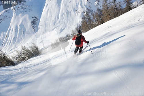 Image of skiing on fresh snow at winter season at beautiful sunny day