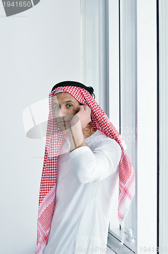 Image of arab business man at bright office