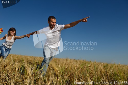 Image of happy couple in wheat field