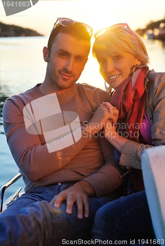 Image of couple in love  have romantic time on boat