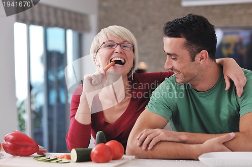 Image of young couple have fun in modern kitchen