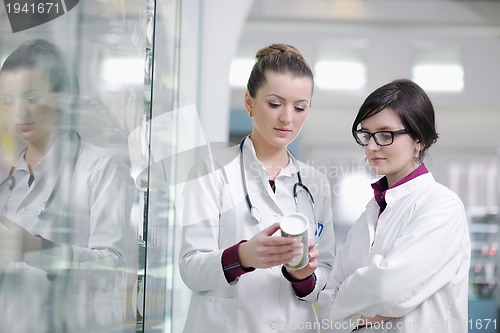 Image of team of pharmacist chemist woman  in pharmacy drugstore