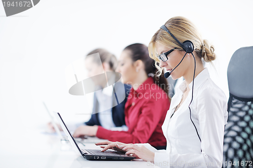 Image of business woman group with headphones