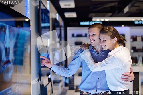 Image of people buy  in consumer electronics store