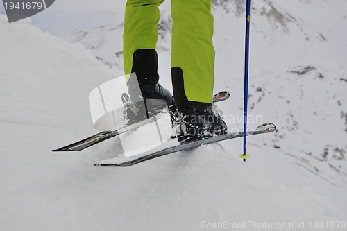 Image of skiing on fresh snow at winter season at beautiful sunny day