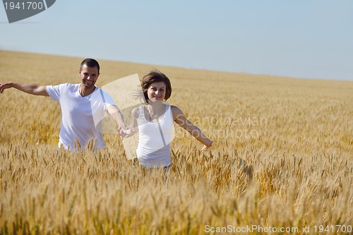 Image of happy couple in wheat field