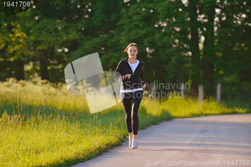 Image of Young couple jogging