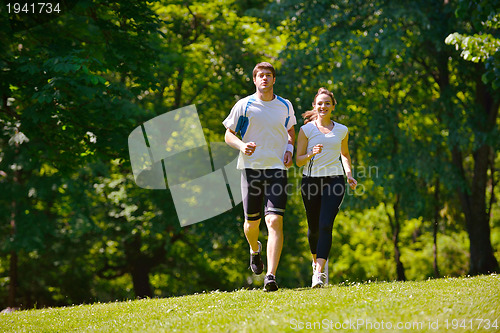 Image of Young couple jogging