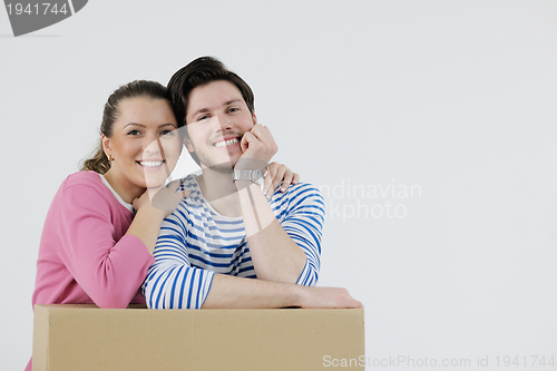 Image of Young couple moving in new home