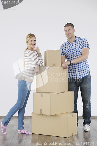 Image of Young couple moving in new home