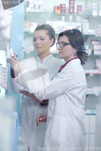 Image of team of pharmacist chemist woman  in pharmacy drugstore