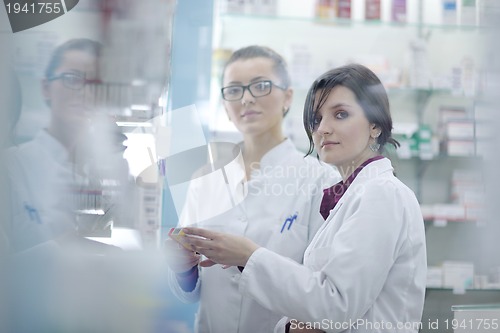 Image of team of pharmacist chemist woman  in pharmacy drugstore