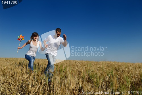 Image of happy couple in wheat field