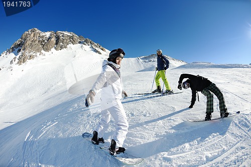 Image of winter portrait of friends at skiing