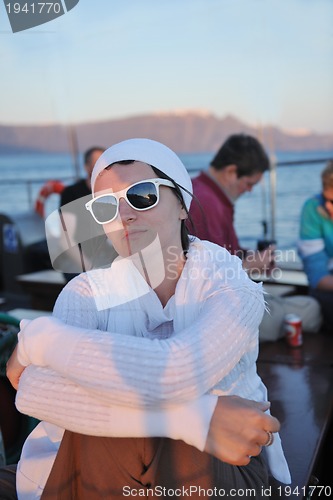 Image of Greek woman on the streets of Oia, Santorini, Greece