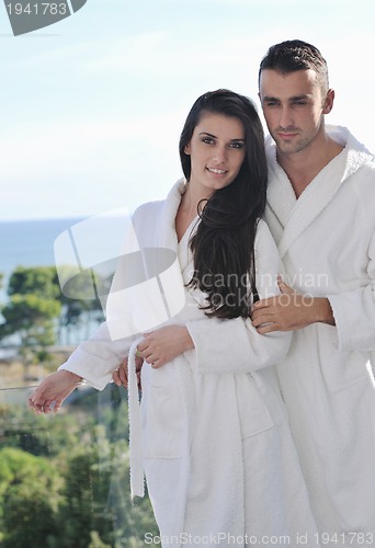 Image of couple relaxing on balcony