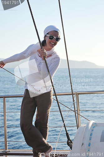 Image of Greek woman on the streets of Oia, Santorini, Greece