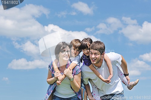 Image of happy young family have fun outdoors