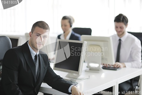 Image of business people group working in customer and help desk office