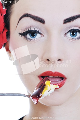 Image of beautiful young woman eat sweet cake