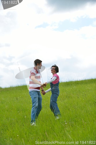 Image of romantic young couple in love together outdoor