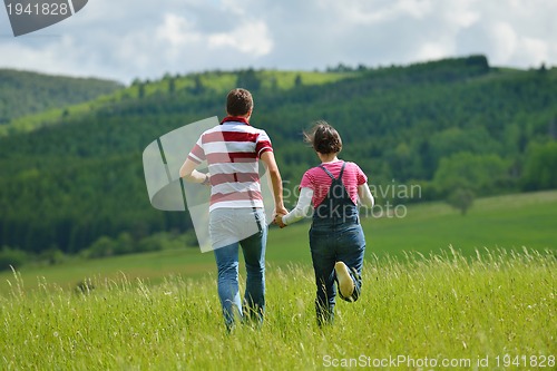 Image of romantic young couple in love together outdoor