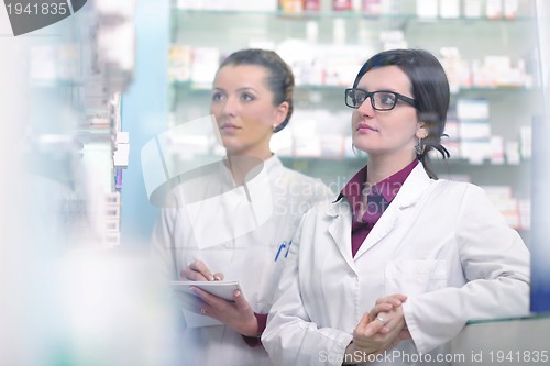 Image of team of pharmacist chemist woman  in pharmacy drugstore