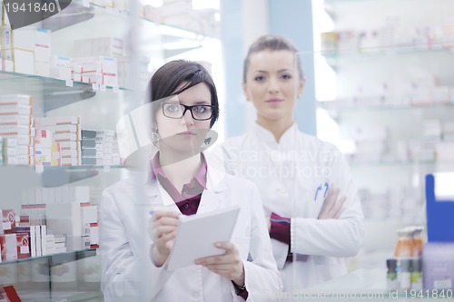 Image of team of pharmacist chemist woman  in pharmacy drugstore