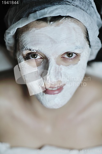 Image of woman with facial mask in cosmetic studio