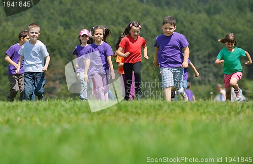 Image of happy kids group  have fun in nature
